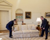 President Obama demonstrates how to move a couch